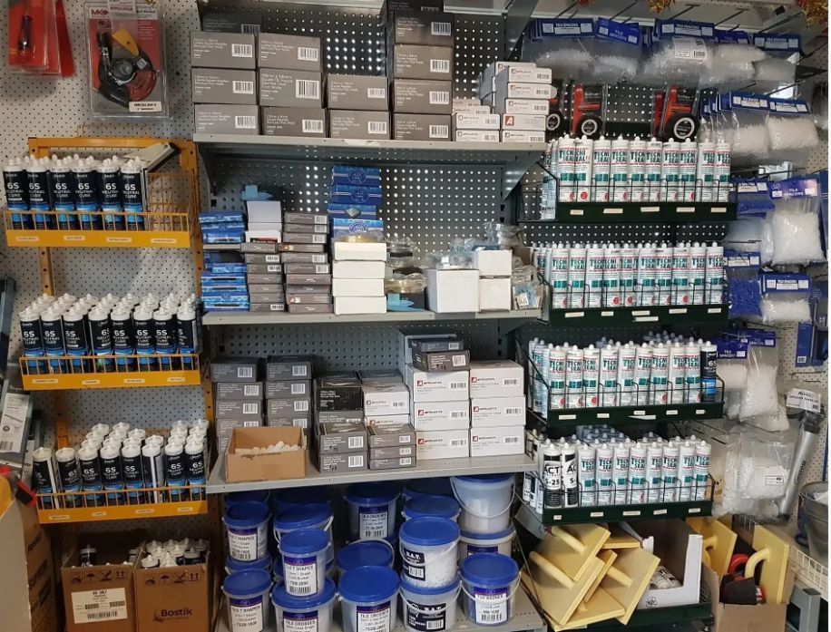 A Store Shelf Filled With Lots Of Bottles And Boxes — Twin Towns Sand & Gravel In Tweed Heads South, NSW