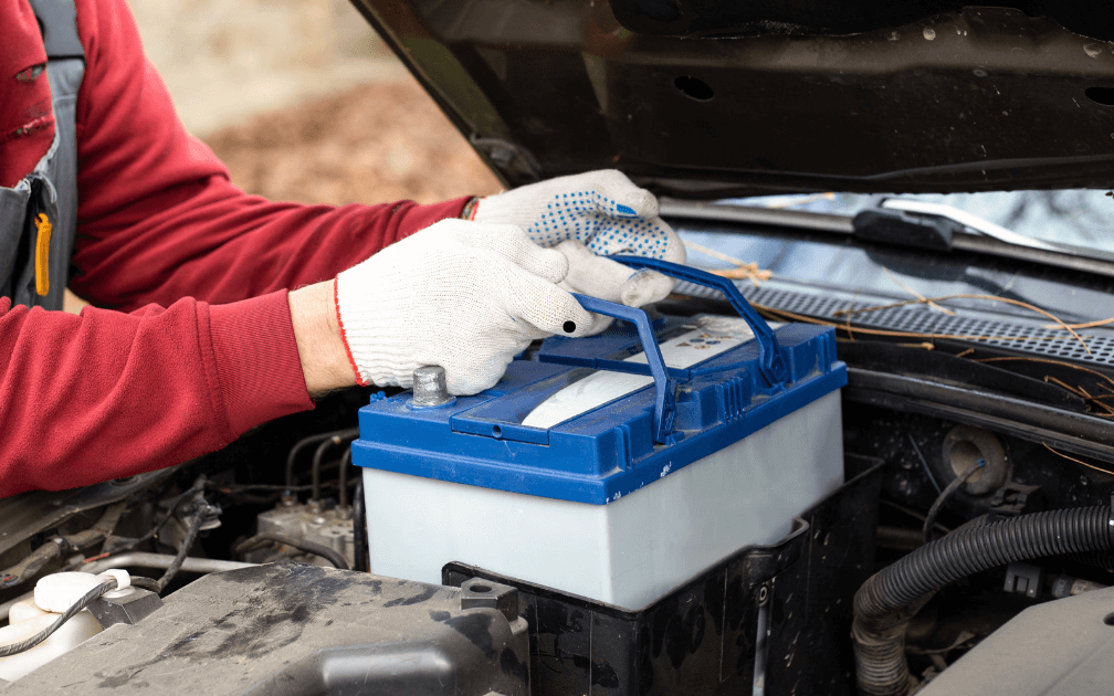 a mechanic doing on-site battery replacement
