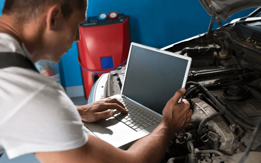 A mechanic doing a vehicle diagnostic in Kennesaw GA