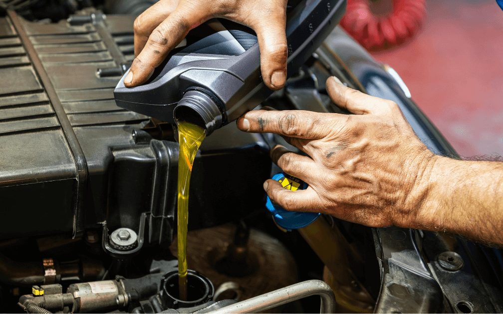 a mechanic doing an at-home oil change
