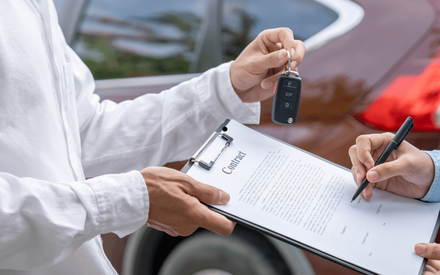 a person buying a used car after a pre-purchase inspection
