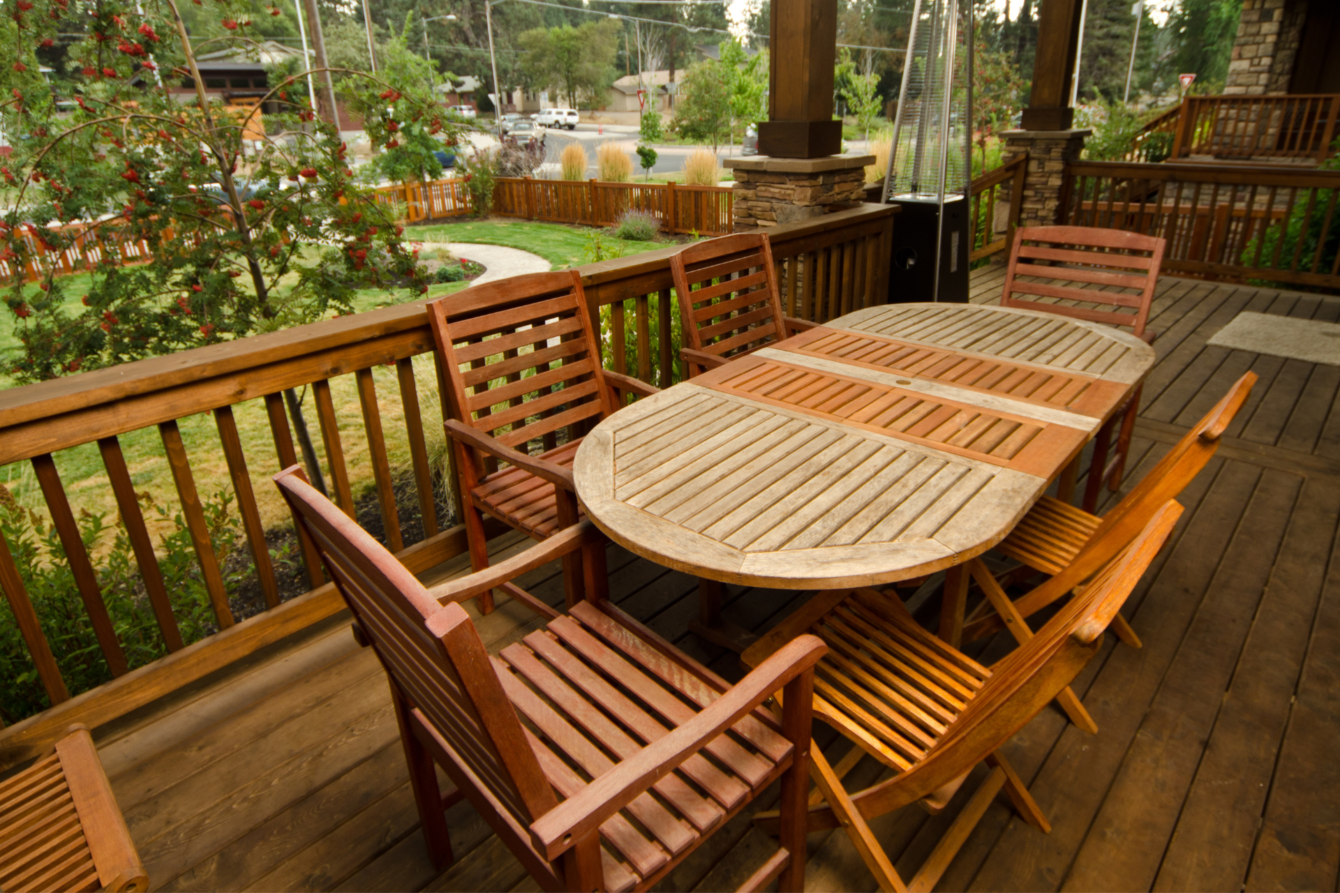A photo of a backyard deck of some residents in Chula Vista. The deck has a big table with seating for 6—a great place to enjoy a meal outside.
