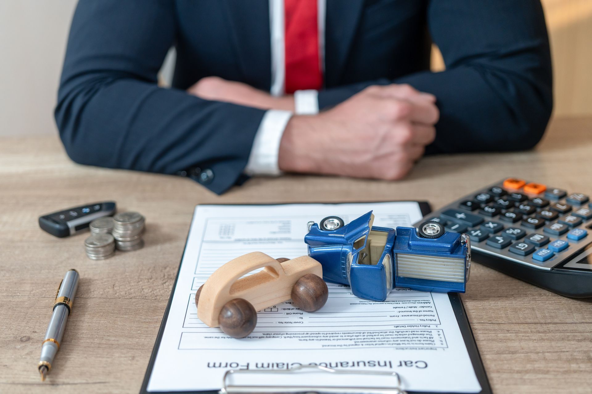 Car accident scene with damaged vehicles, highlighting the need for an accident attorney for legal s