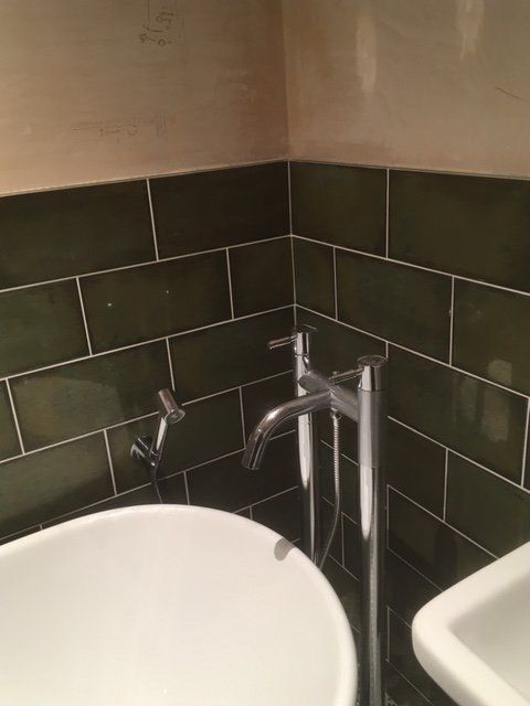 black coloured tiles in the bathroom