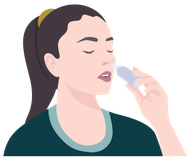 A woman is applying a nasal spray to her nose.