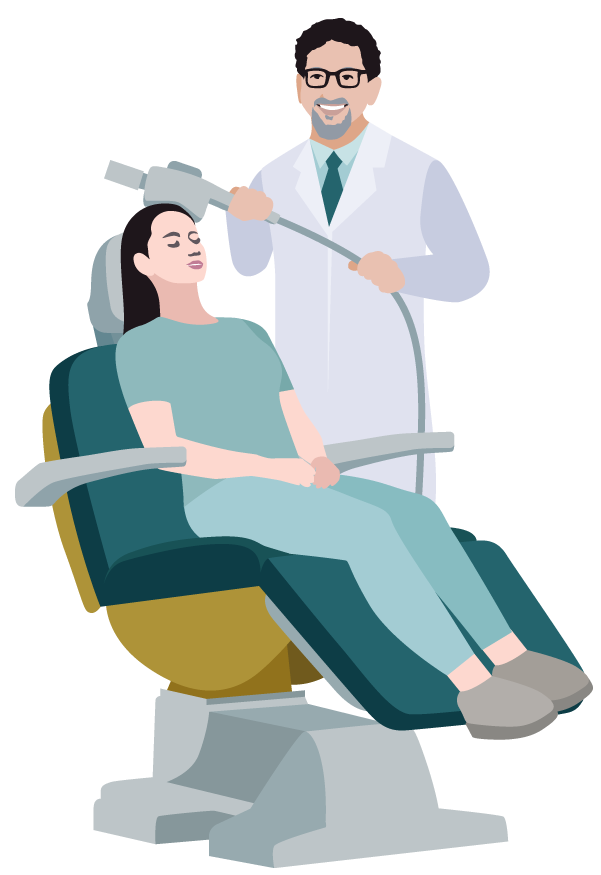 A woman is sitting in a dental chair while a dentist holds a machine.