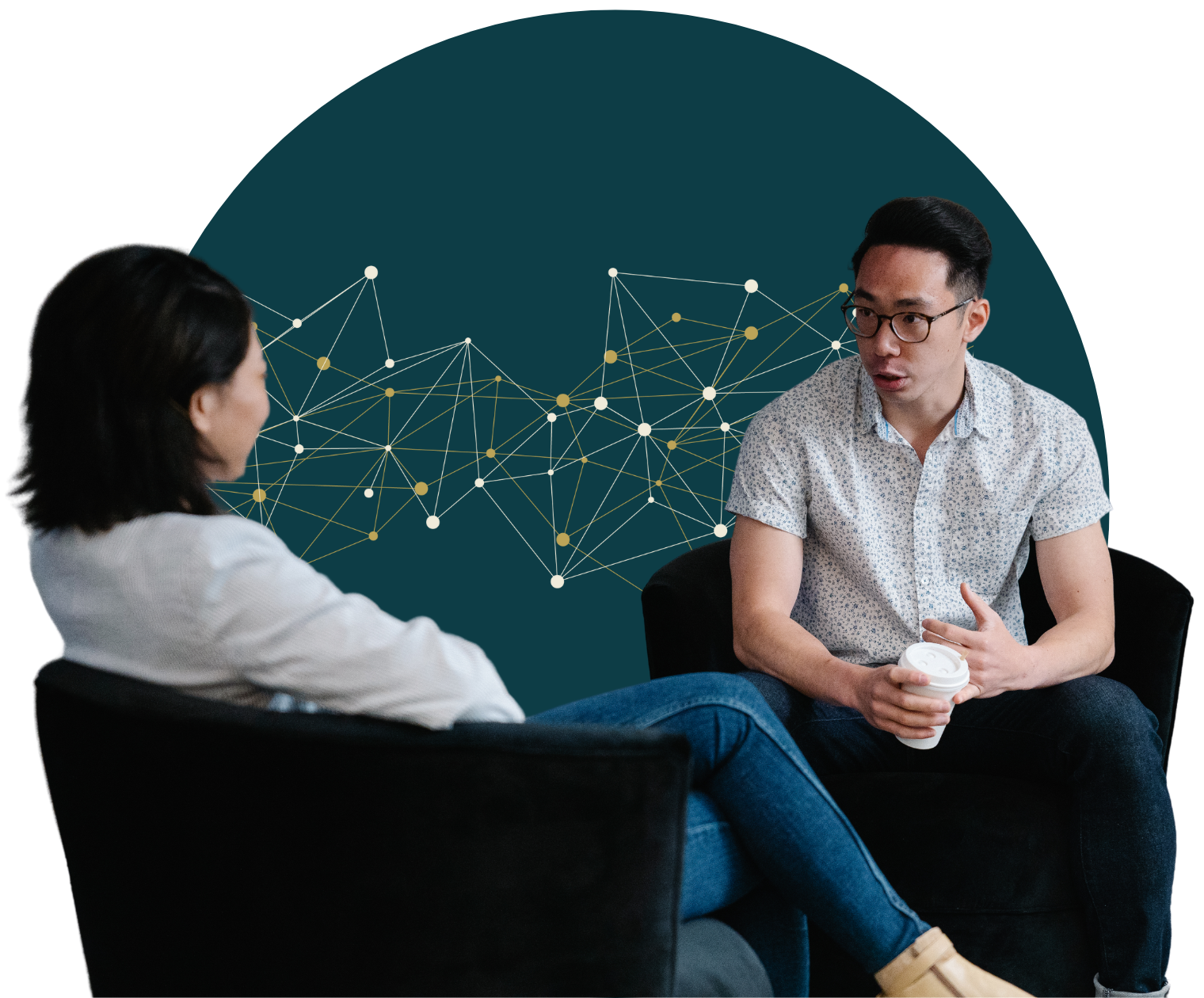 A man and a woman are sitting in chairs having a conversation.