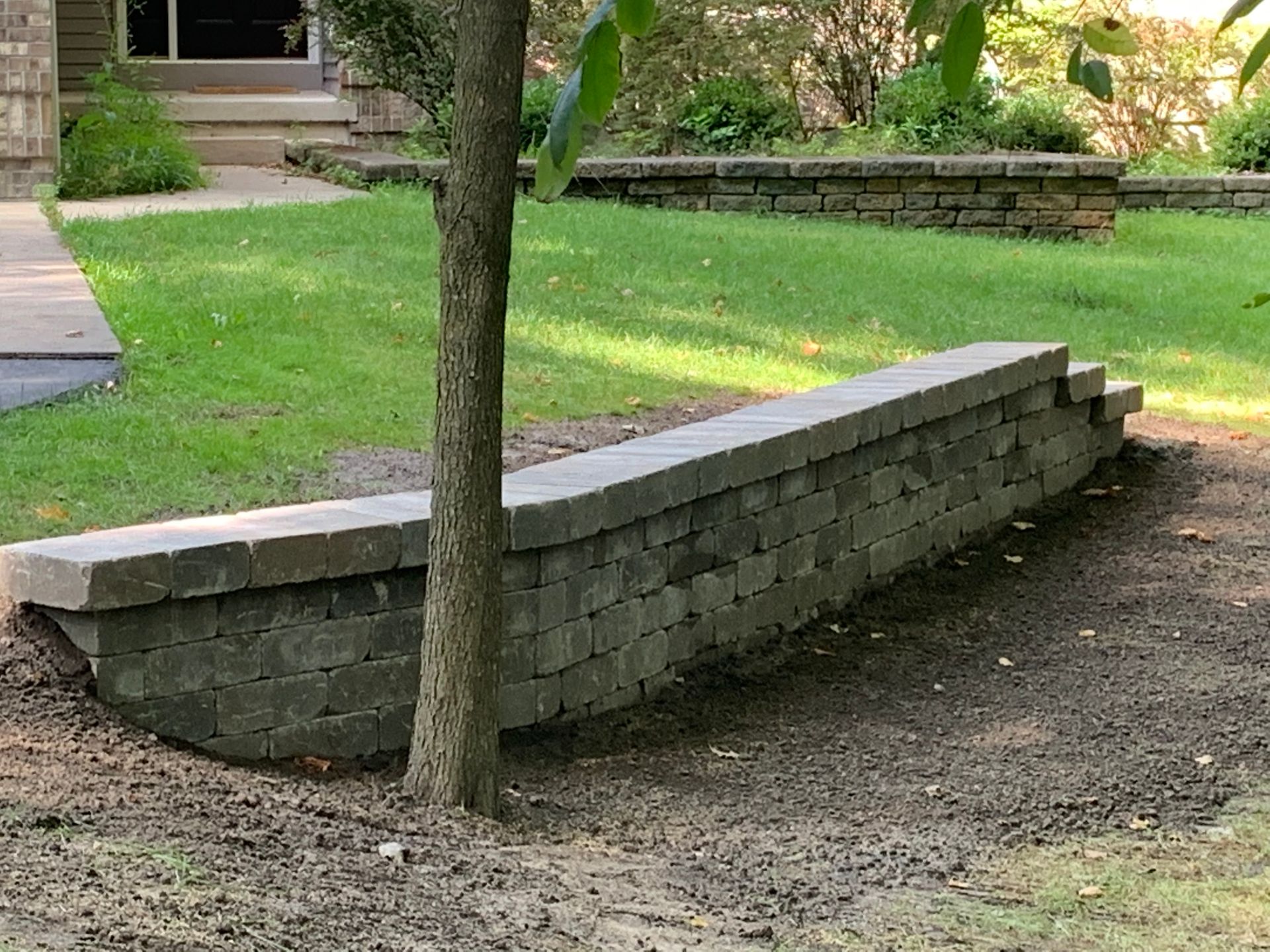 Beautiful Concrete Long Chair — Midland, MI — Maksymum Lawn and Landscaping