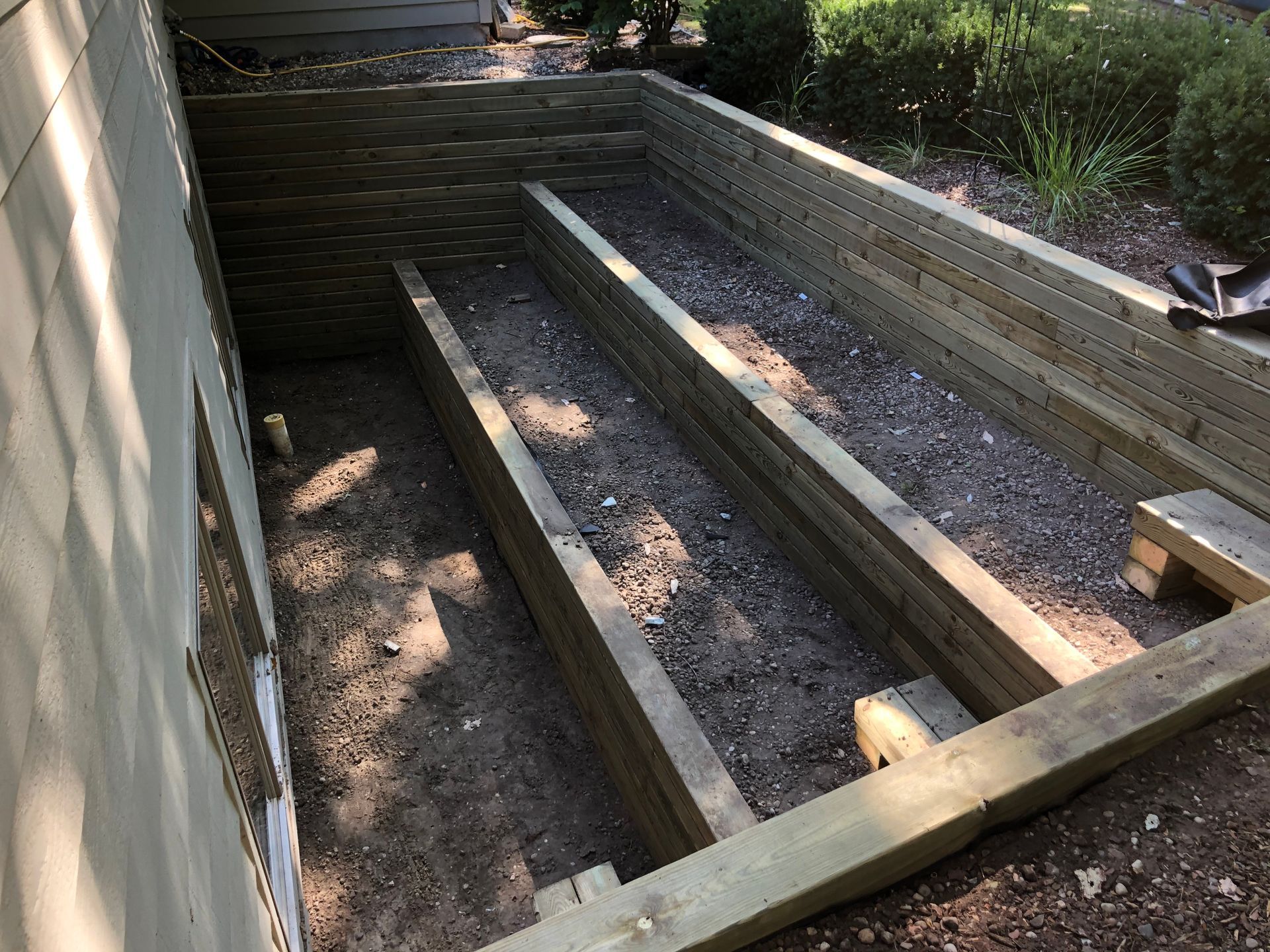 Soil on Basement Stairs — Midland, MI — Maksymum Lawn and Landscaping