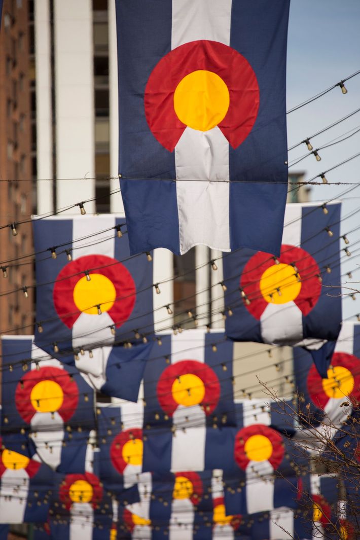 A blue white and red flag with a yellow center