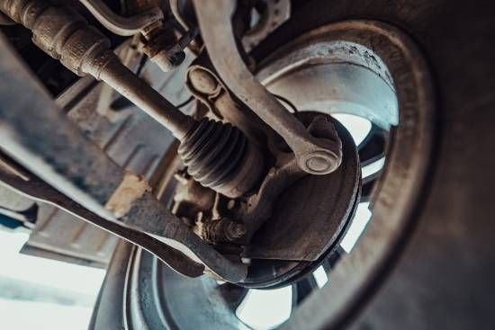 A Close Up of the Suspension System of a Car — High Grade Tyre and Mechanical in Toowoomba City, QLD