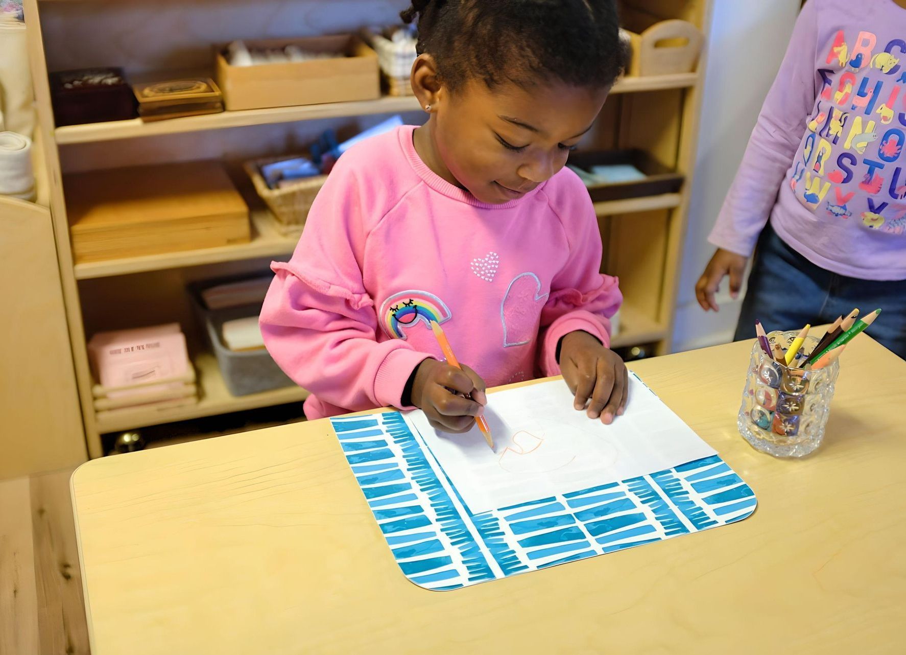 Montessori child working in the classroom