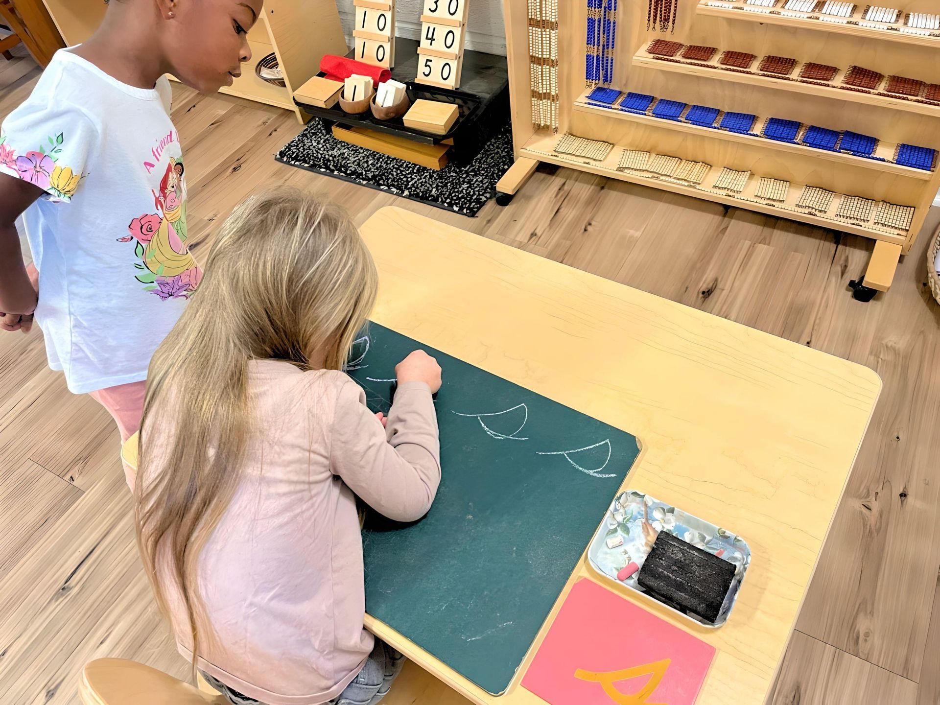Child working with Montessori language materials