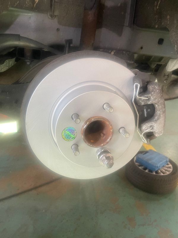 A close up of a brake disc on a car. | Paul Campanella's Auto Centers