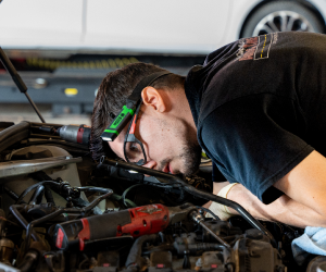 mechanic inspecting car | Paul Campanella's Auto Centers