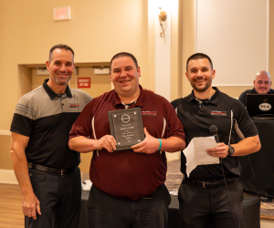 Our team holding awards | Paul Campanella's Auto Centers