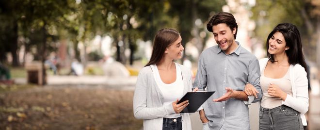 A survey being administered in person in a park
