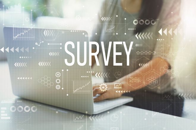 Woman taking a survey on a laptop