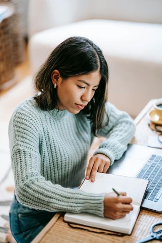 A woman taking a survey on a laptop