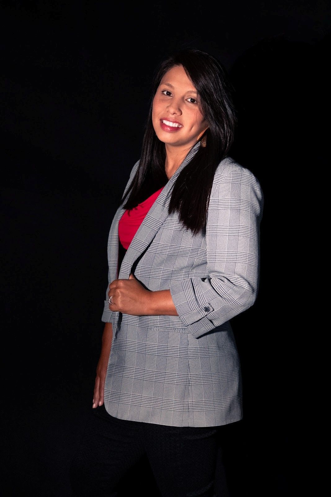 Row of modern houses with driveways on a sunny day.