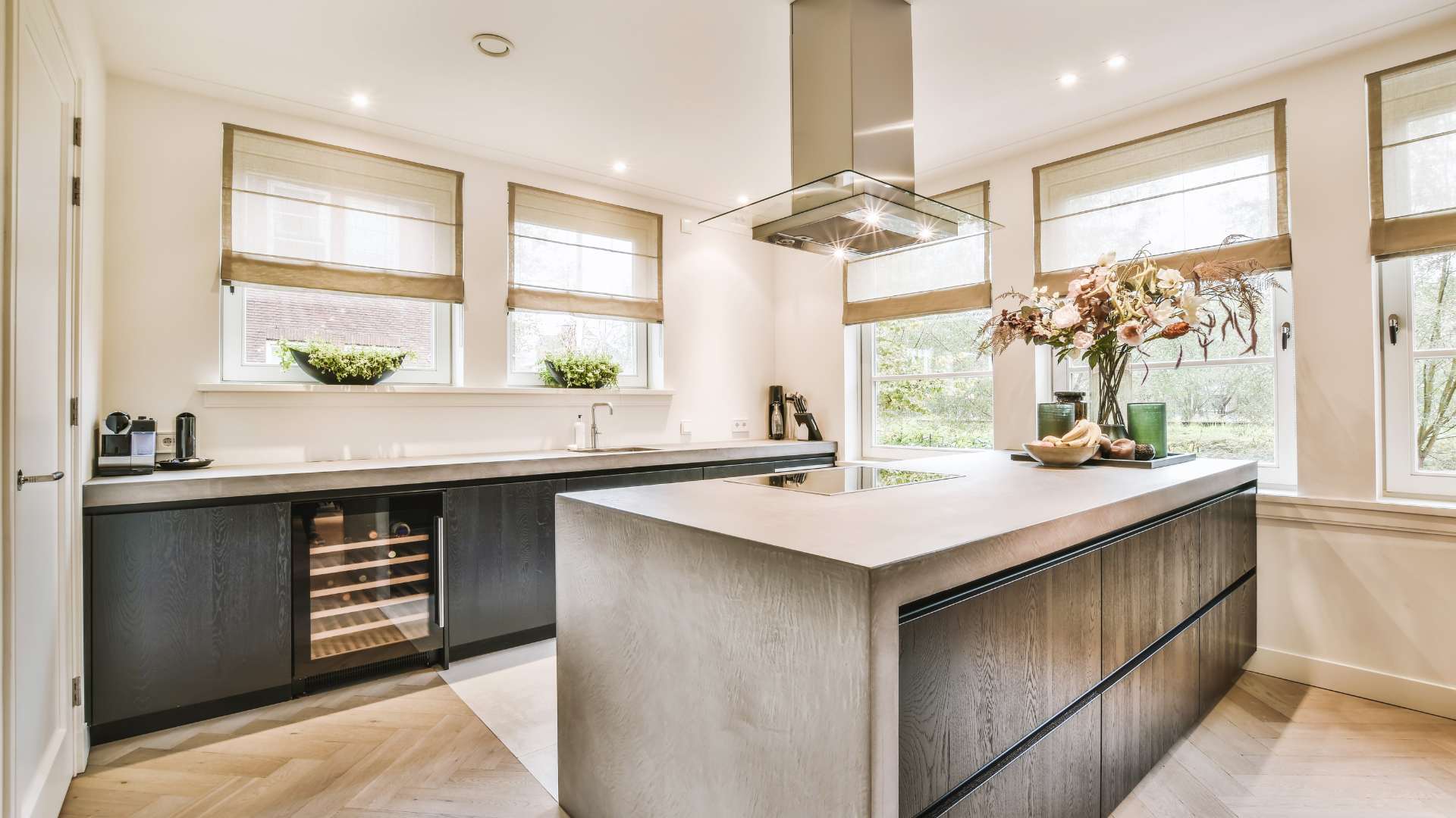 A kitchen with dark wood cabinets and stainless steel appliances