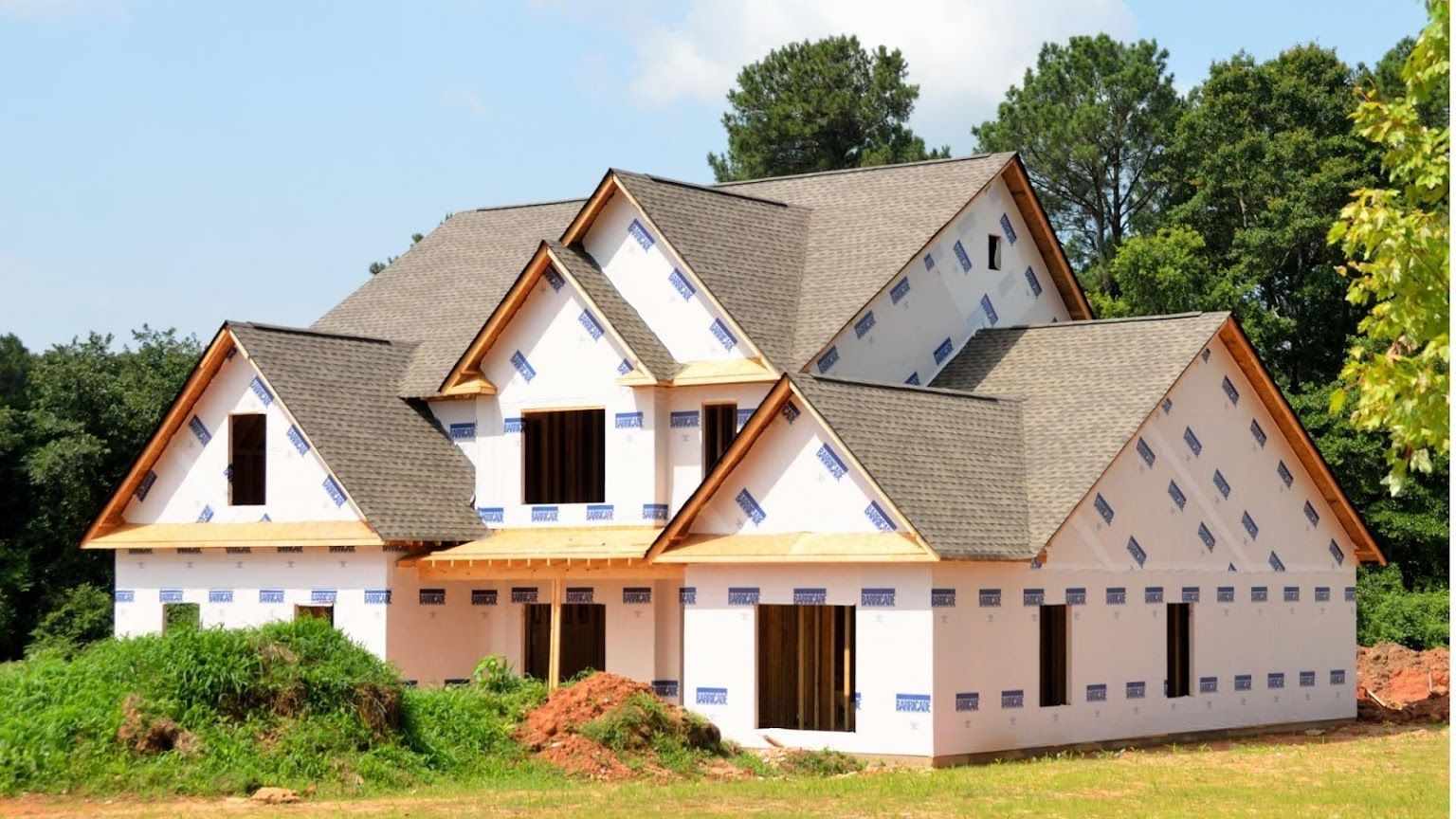 A house that is being built in a field