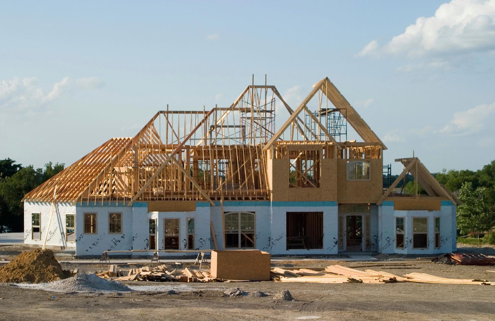 A large house is being built in a residential area