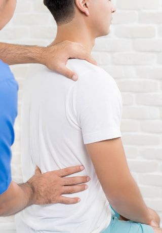Therapist Treating Lower Back Pain — Beloit, WI — Pelock Chiropractic