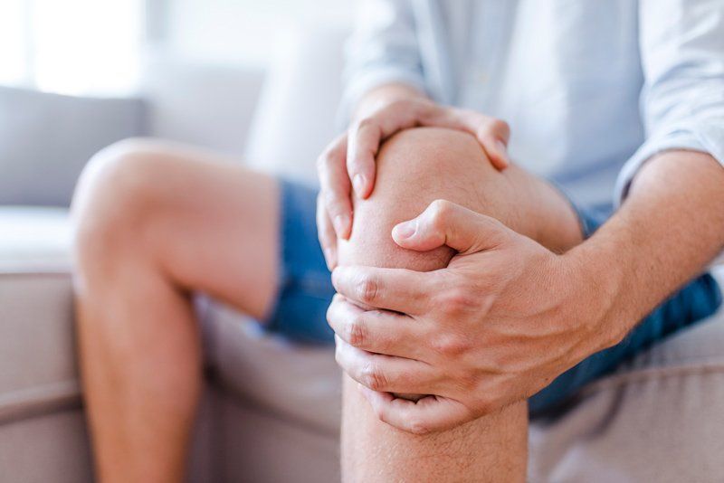 Man Suffering from Knee Pain — Beloit, WI — Pelock Chiropractic