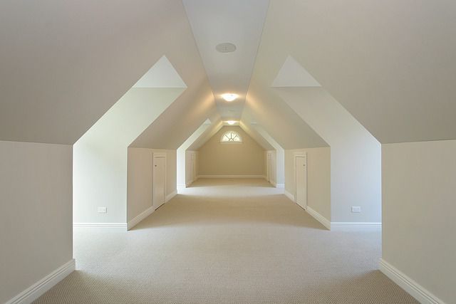 An empty hallway with arched ceilings and white walls