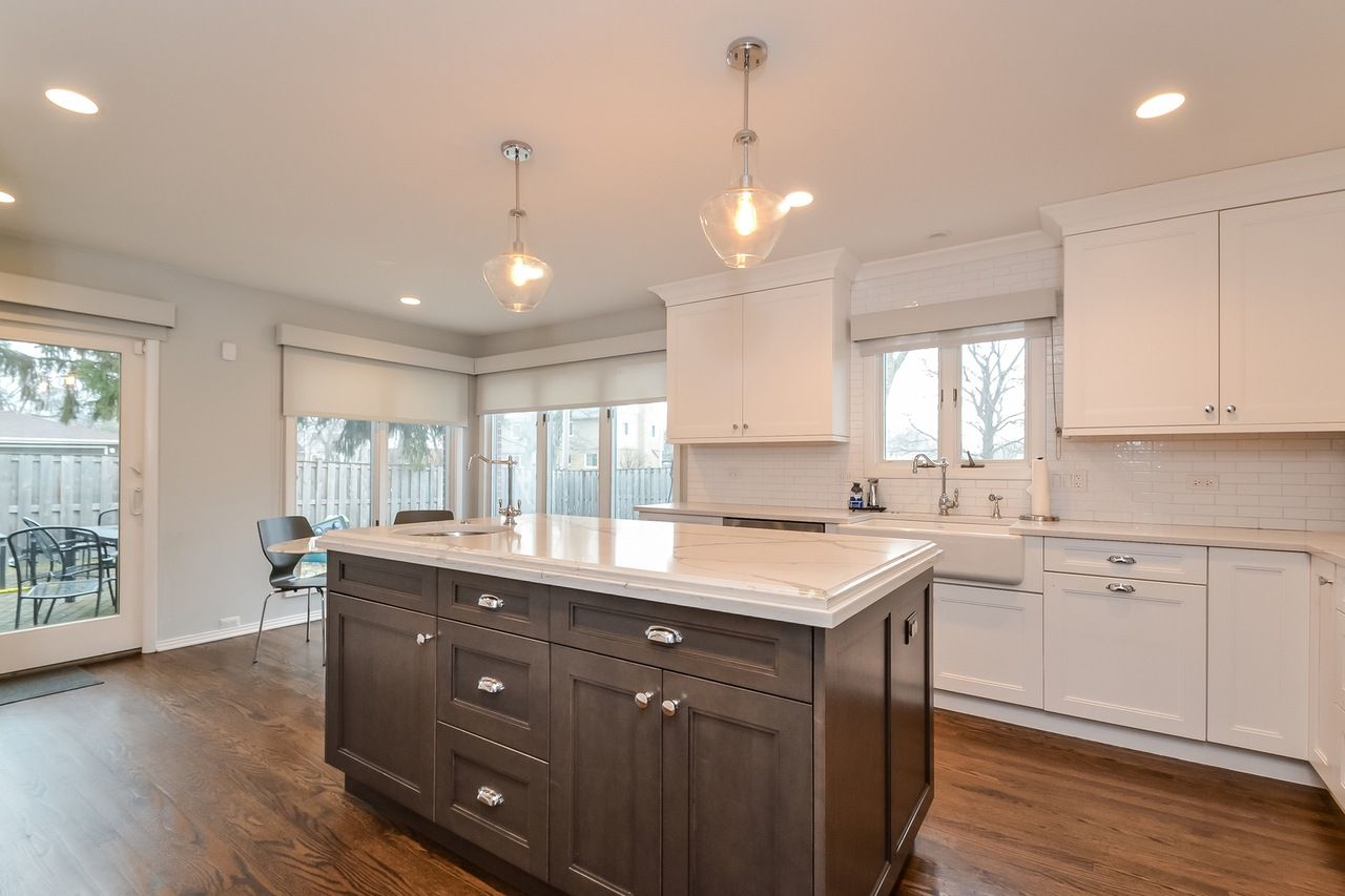There is a large island in the middle of the kitchen.