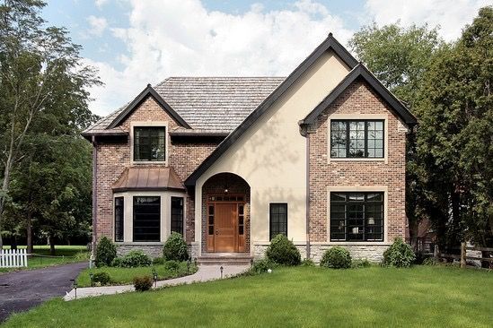 A large brick house with a lot of windows