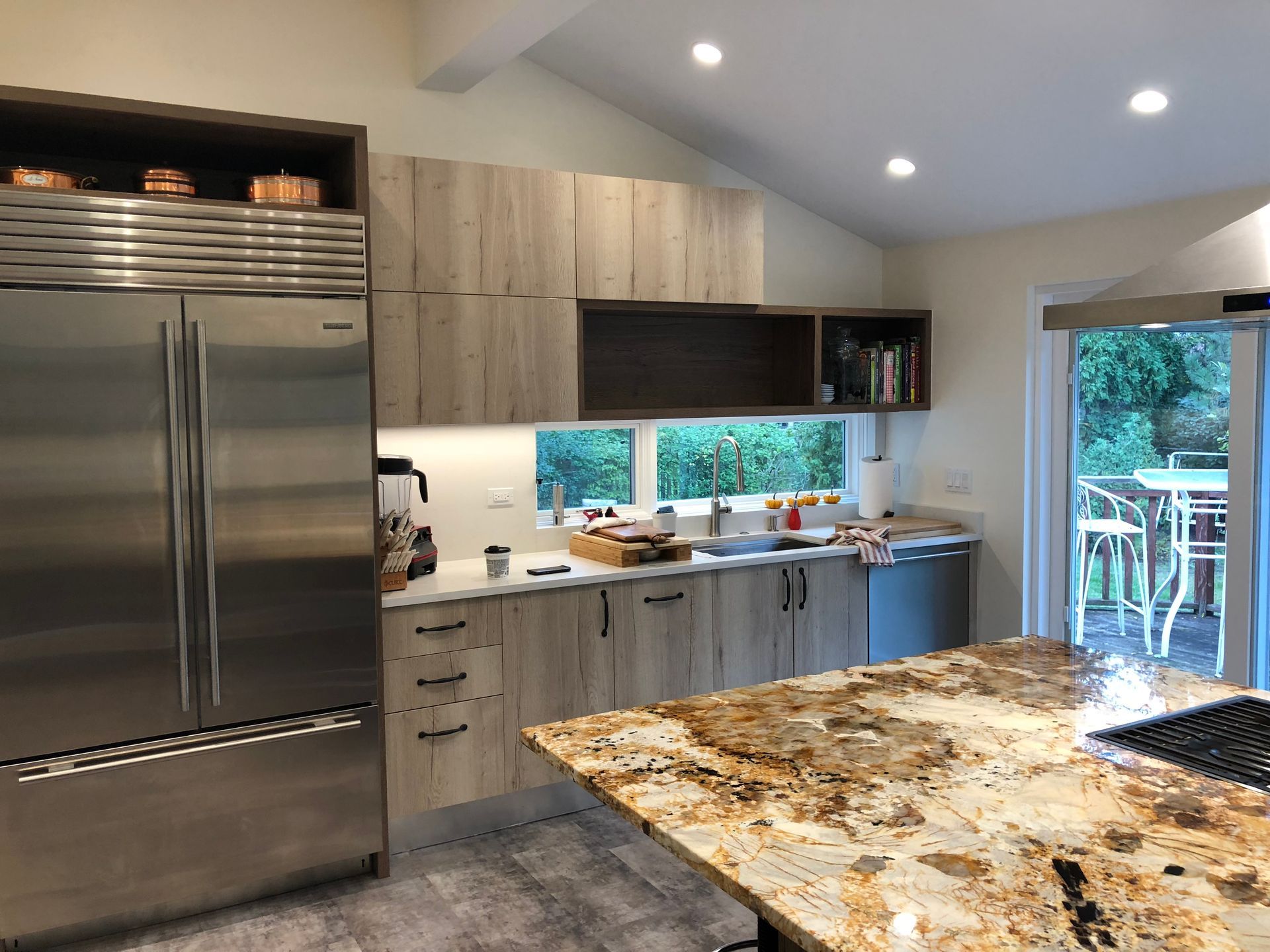 A kitchen with stainless steel appliances and granite counter tops