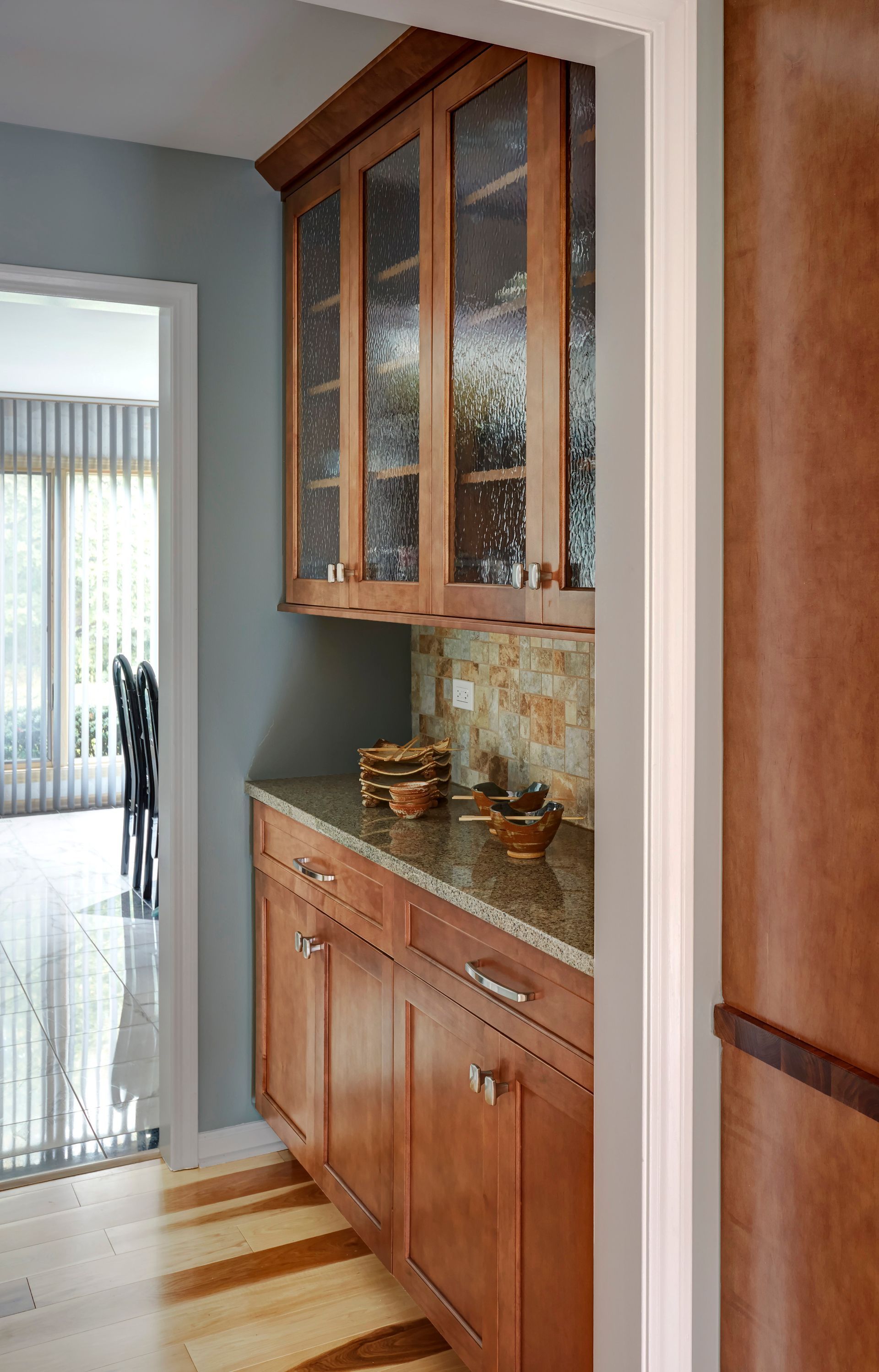 A kitchen with wooden cabinets and granite counter tops