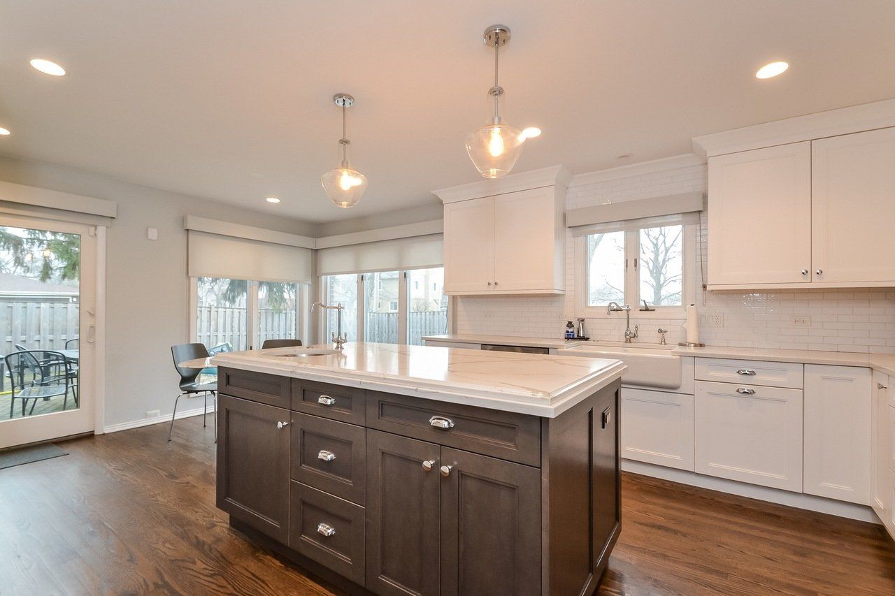 There is a large island in the middle of the kitchen.