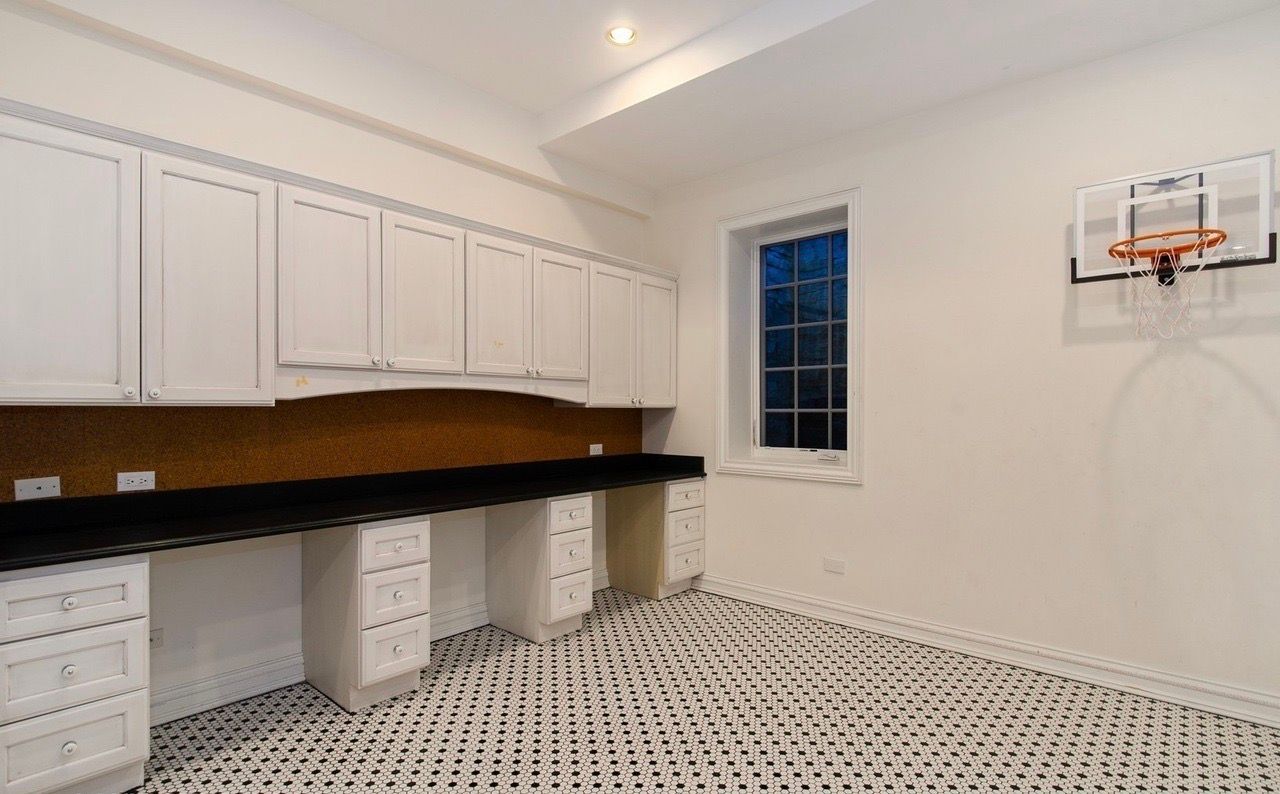 There is a basketball hoop on the wall in the room.