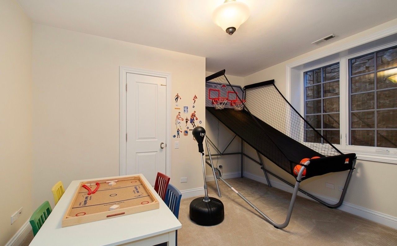 There is a basketball hoop in the middle of the room.