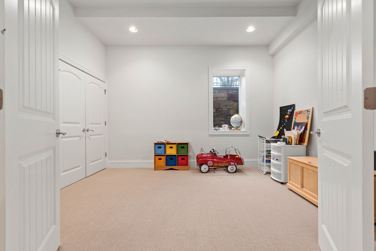 There is a toy car in the middle of the room.