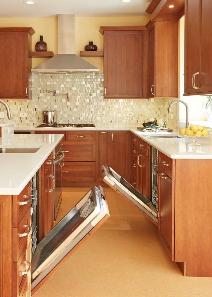 A kitchen with a dishwasher that is open