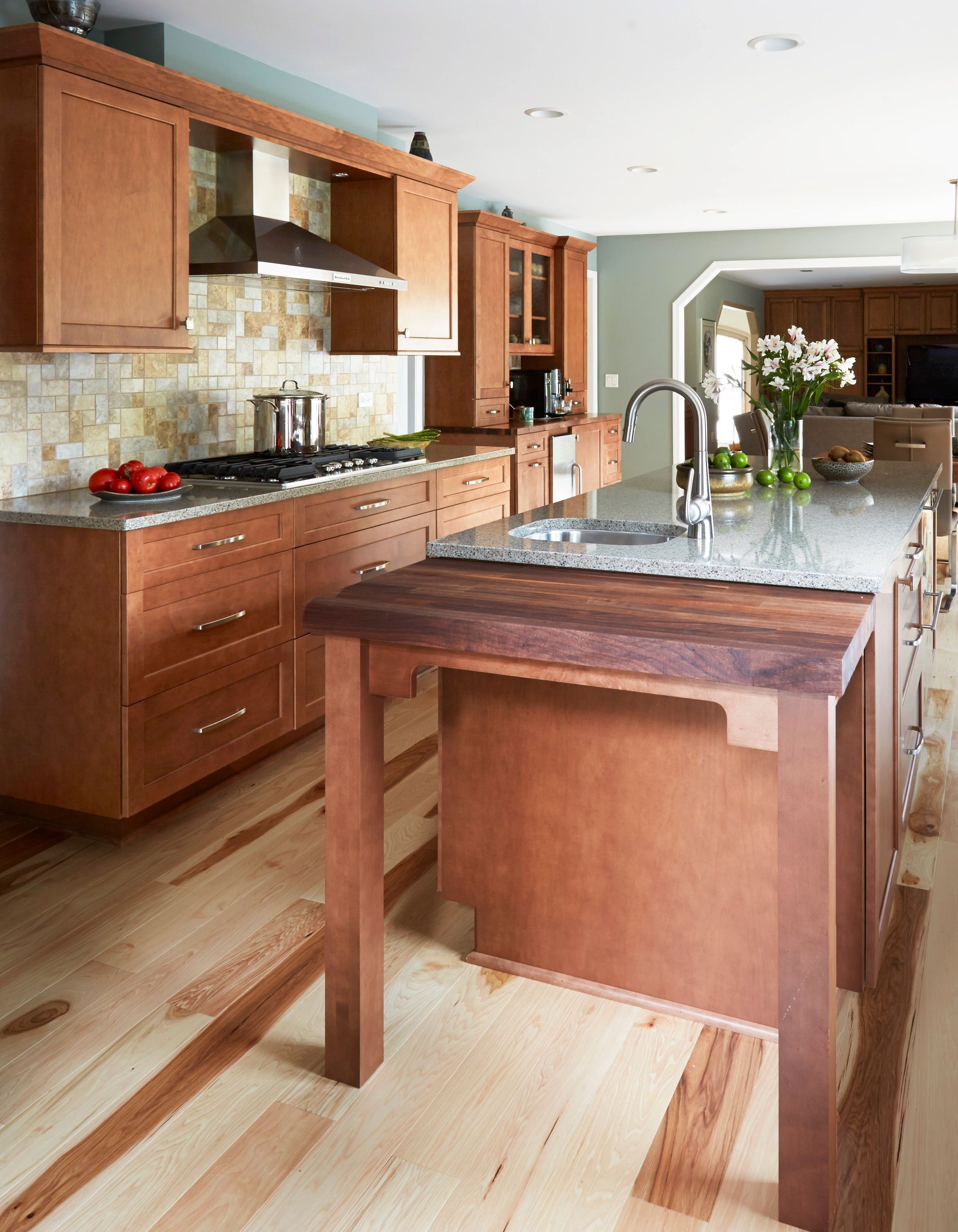 A kitchen with wooden cabinets and granite counter tops