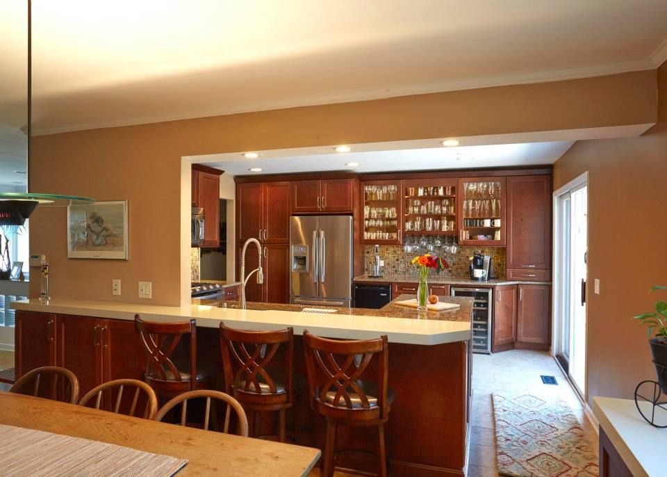 A kitchen with stainless steel appliances and wooden cabinets