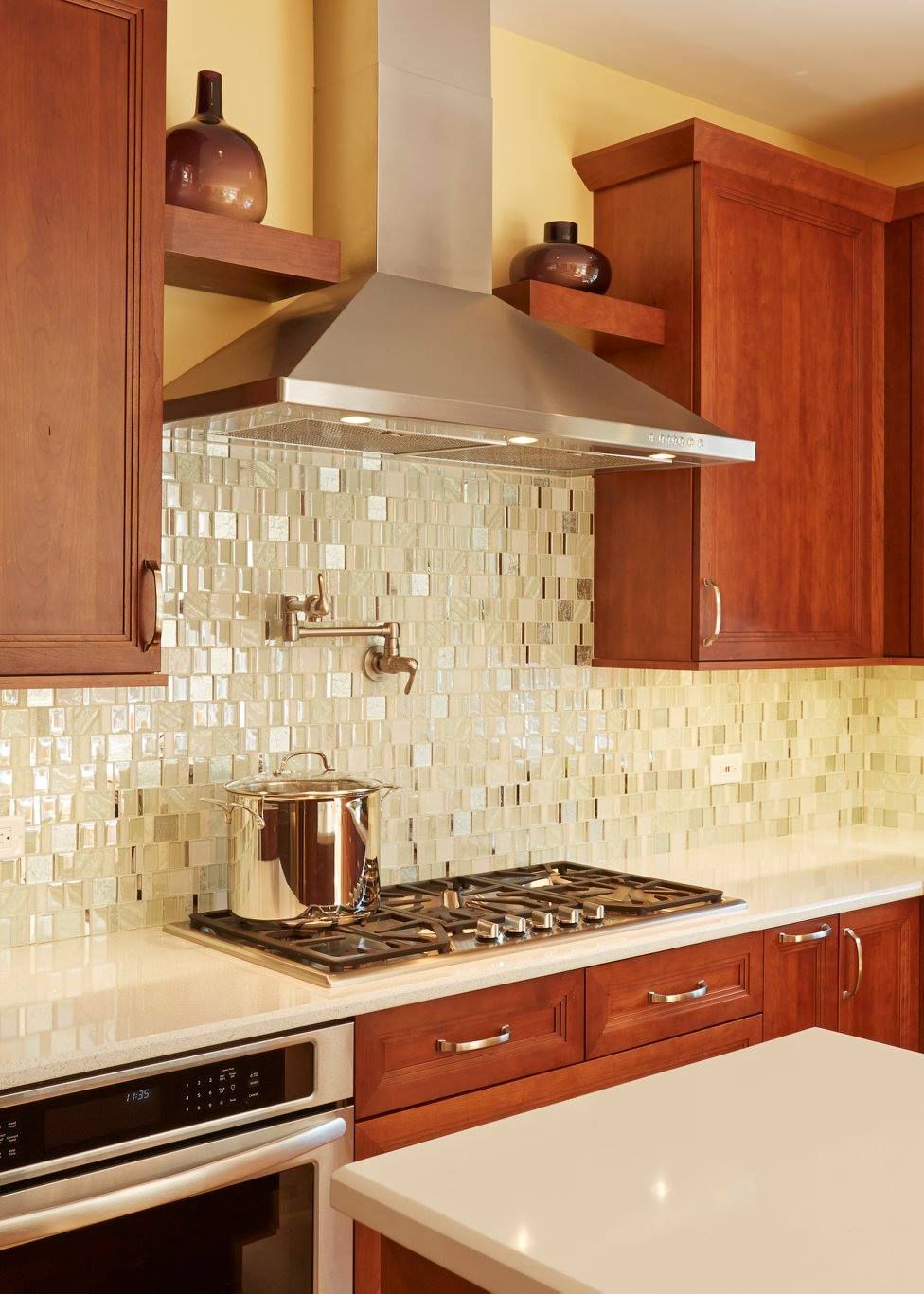 A kitchen with wooden cabinets and a stove top oven