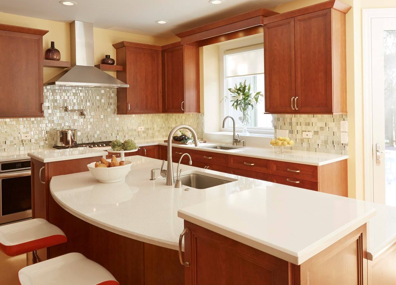 A kitchen with wooden cabinets and white counter tops