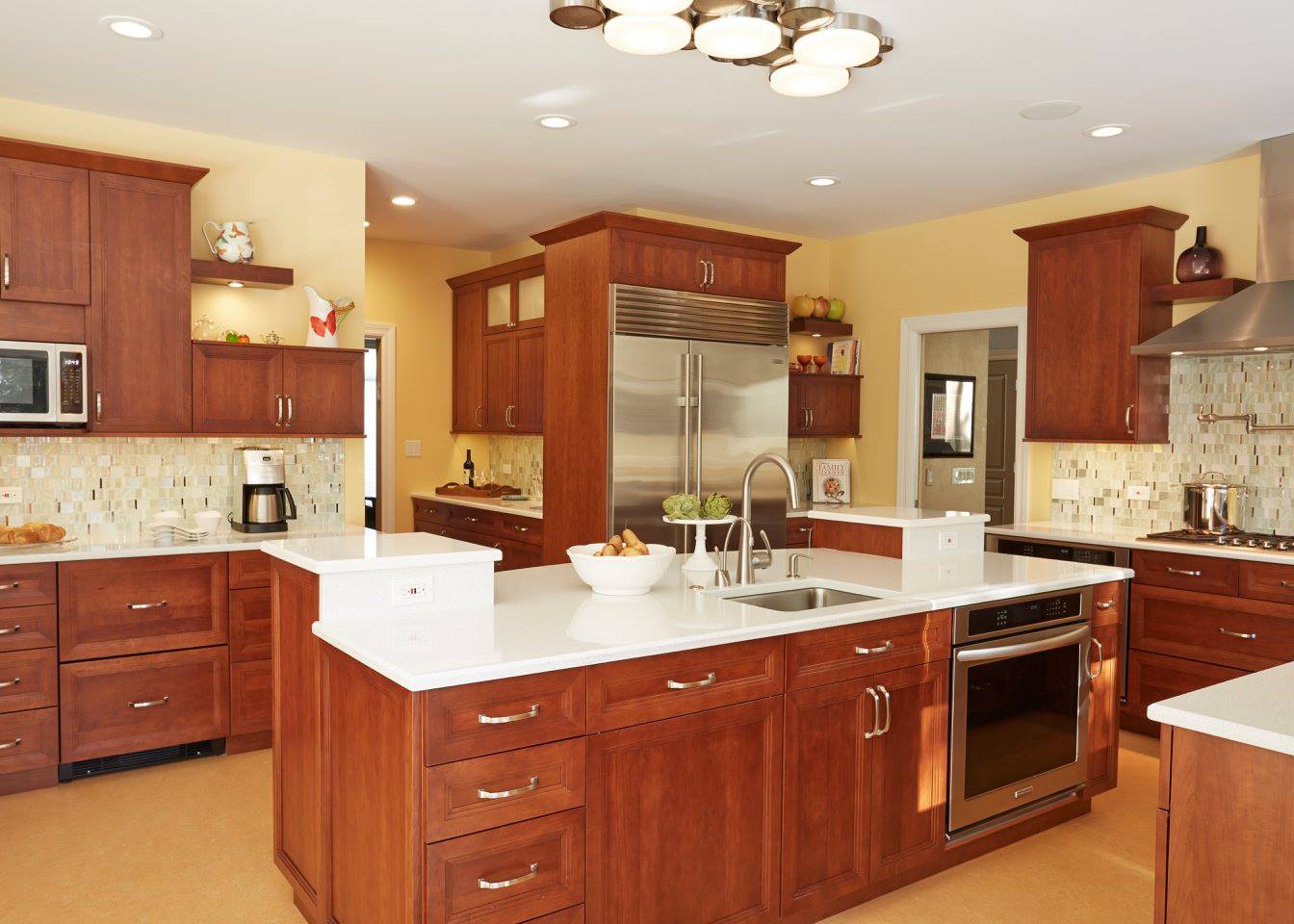 A kitchen with wooden cabinets and stainless steel appliances