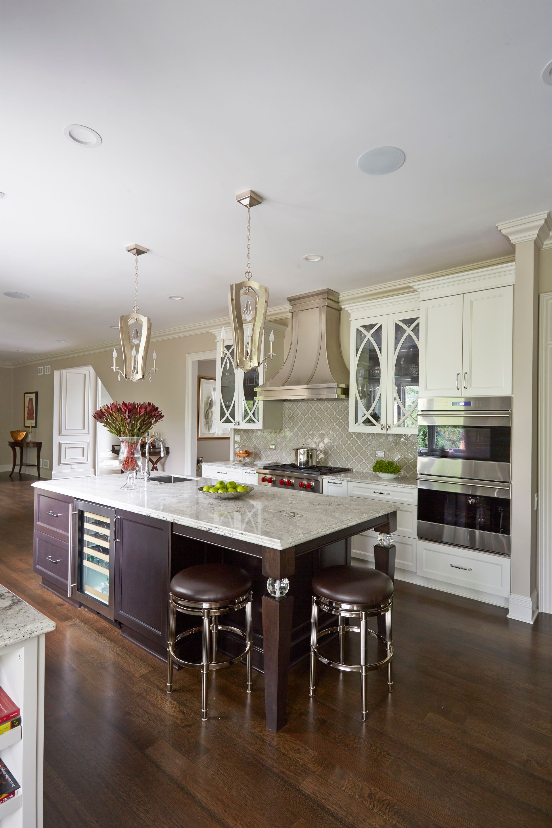 A kitchen with a large island and stools