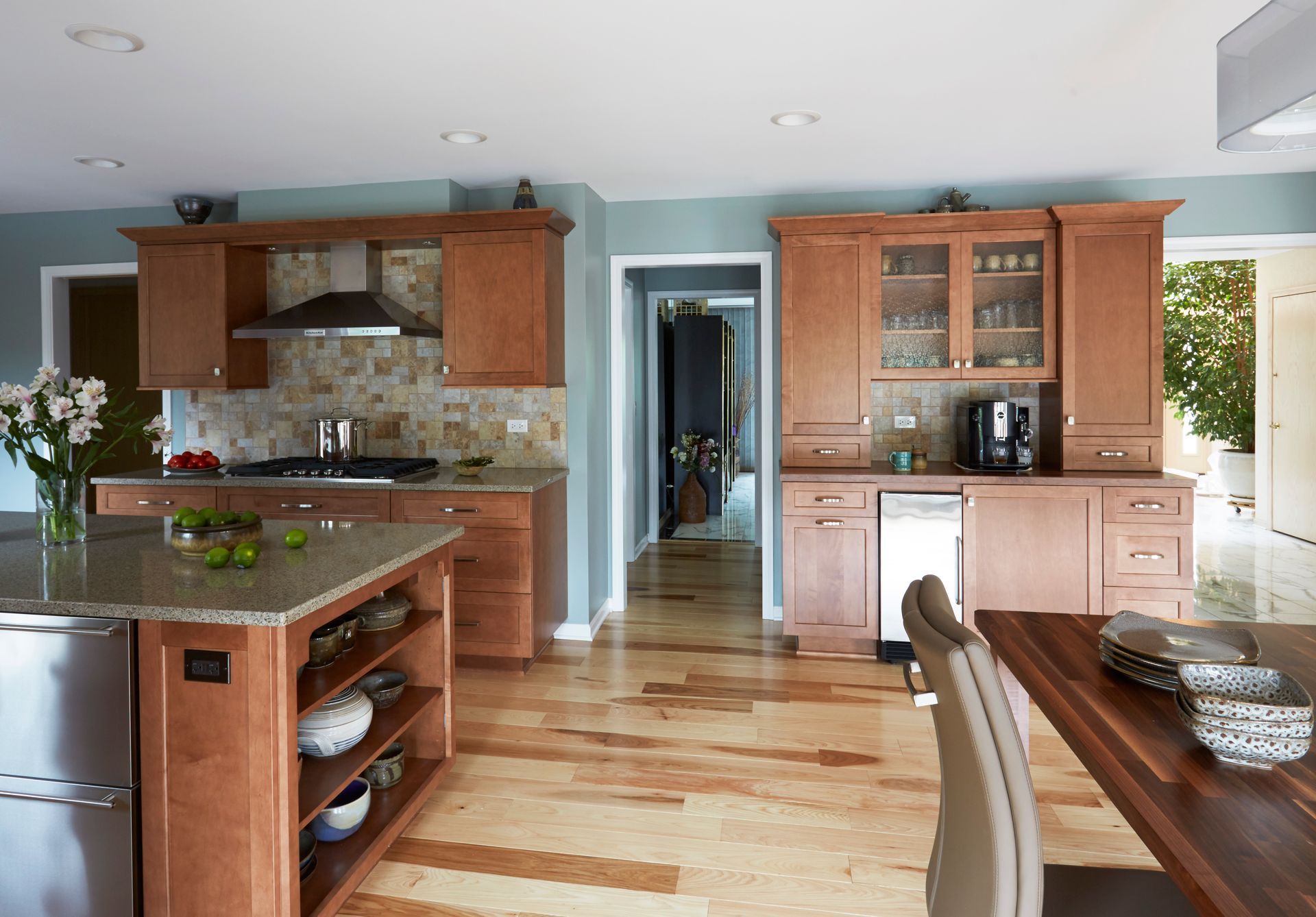 A kitchen with wooden cabinets and stainless steel appliances