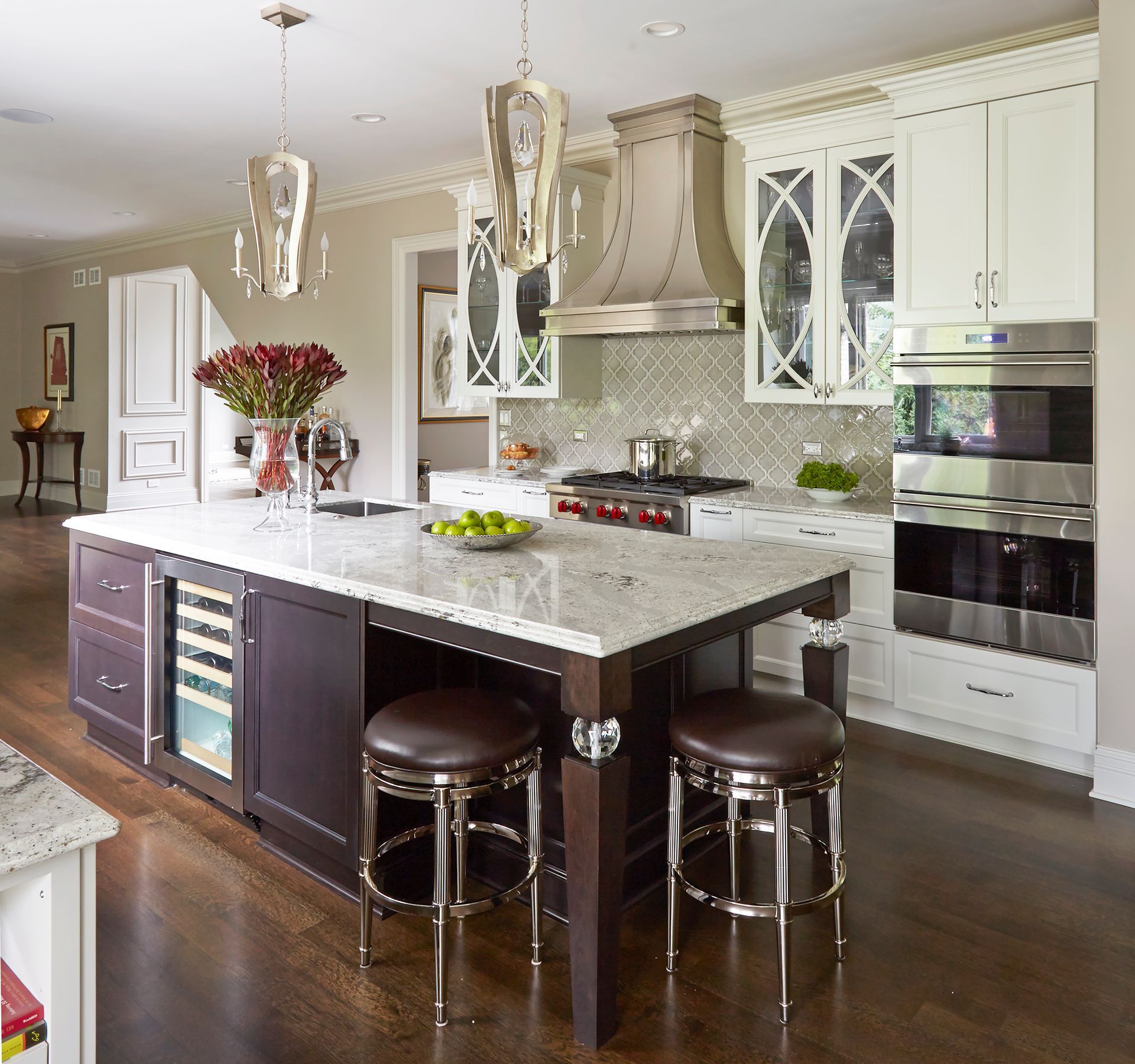 A kitchen with a large island and stools