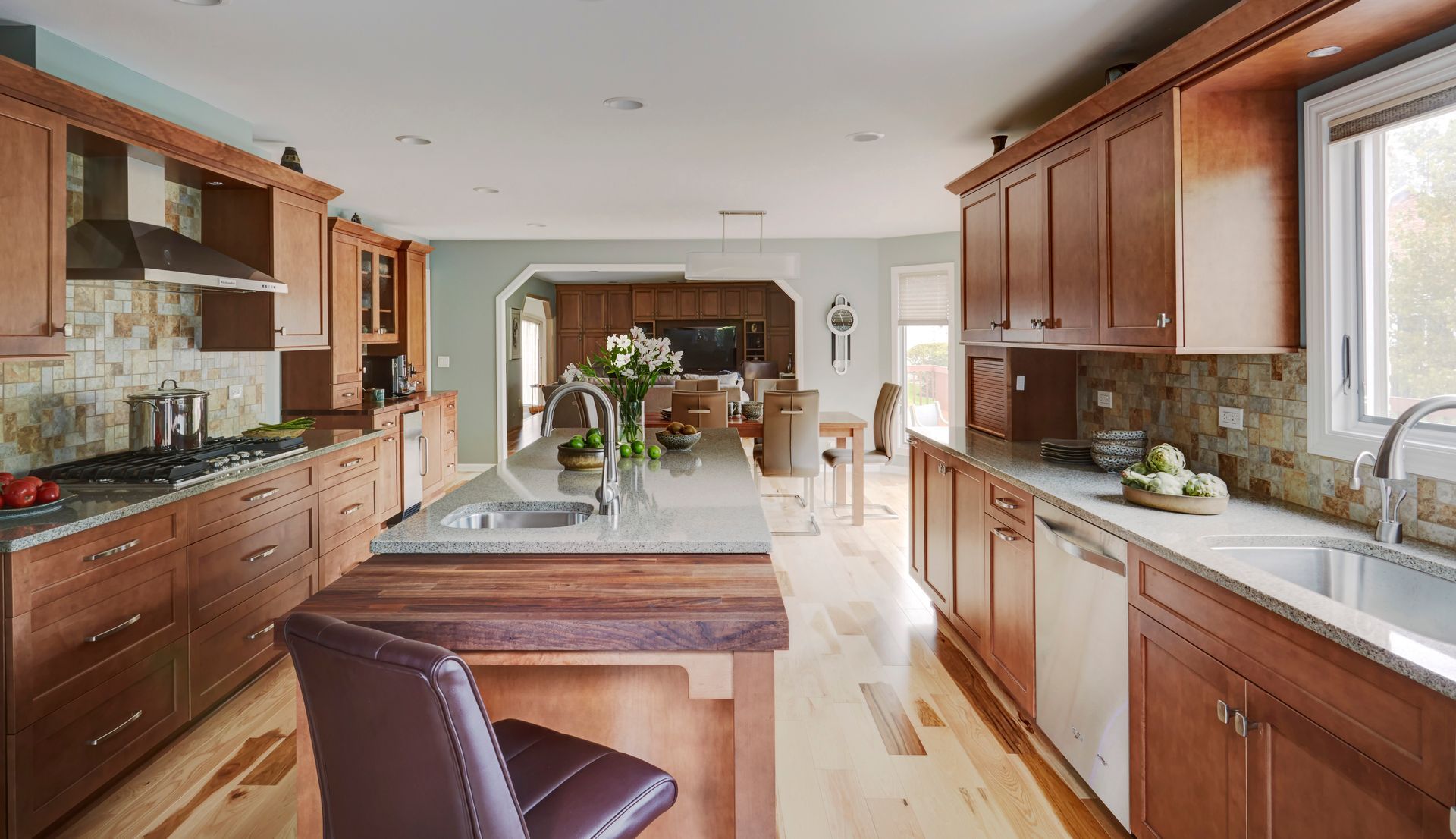 A kitchen with wooden cabinets and stainless steel appliances