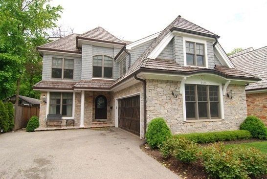 A large house with a garage and a driveway
