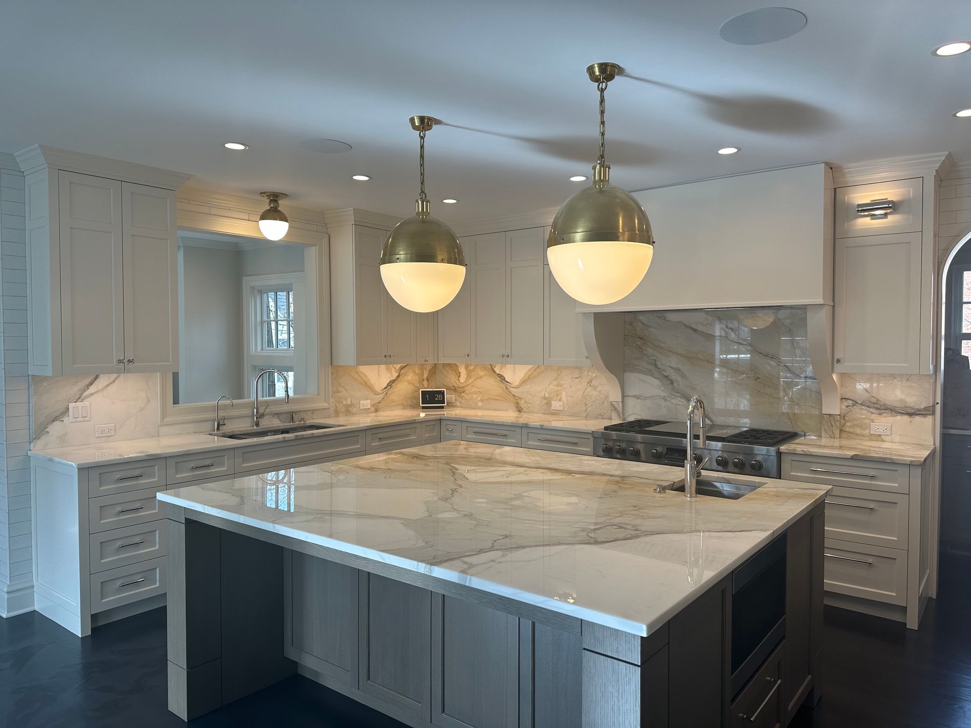 There is a large island in the middle of the kitchen.